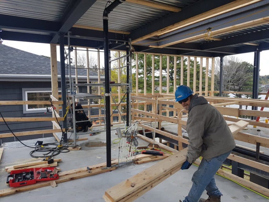Ruggles Contracting team member working on framing a new build home in Halifax.